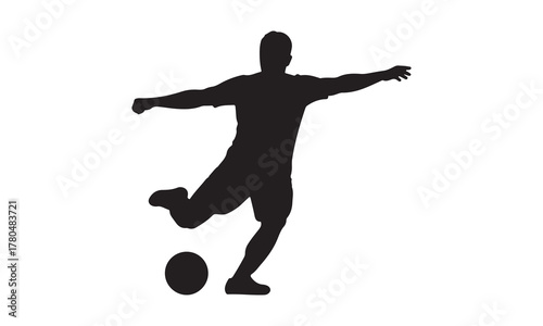 Soccer player kicking ball silhouette