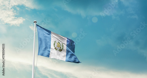 Guatemala national flag fluttering. The flag blowing in beautiful soft sky. Guatemala national flag for independence day.