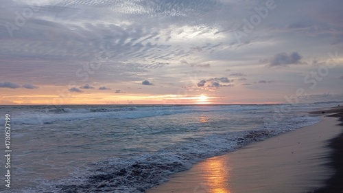 Photos Vibrant sunset over the ocean with dramatic pink and orange altocumulus clouds c