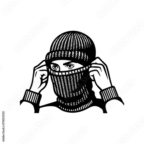 Person pulling up a knit balaclava, showing preparation for cold weather or outdoor winter activities.