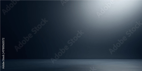 Dark, empty metallic room with a textured grey floor and a single spotlight on the steel wall backdrop