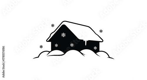 A charming black silhouette of a snow covered house with icicles hanging from the roof during a winter snowfall