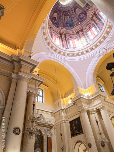 Interior perspective of Saint Nicholas Church with columns and painted dome ceiling, Valletta MALTA