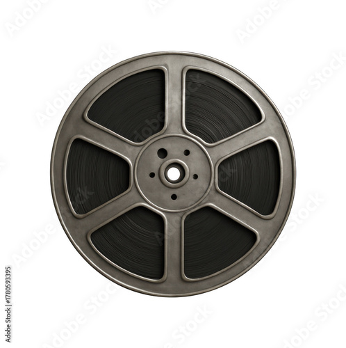 Vintage metal film reel with dark grainy celluloid film wound around the spool against a stark black background