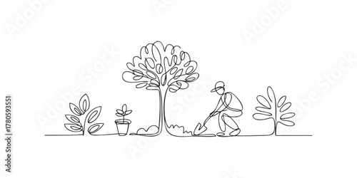 Gardener planting with shovel near tree and plants