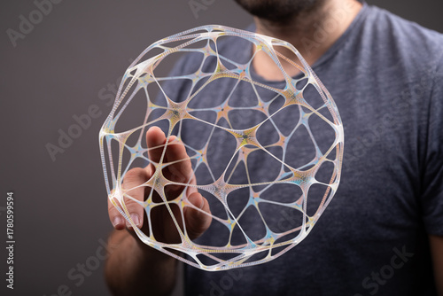 A person holds a geometric ...
