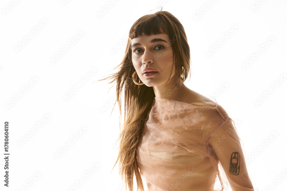 Naklejka premium Young woman exudes confidence and style in a dreamy fashion moment captured indoors