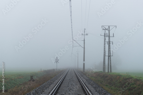 RAILWAY LINE - Railroad among fields and the fog


