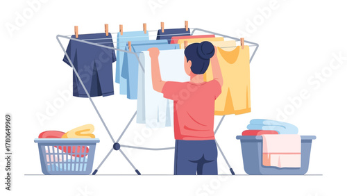 Person hanging laundry on a drying rack after washing clothes.