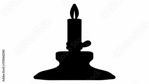 Silhouette of a candle burning brightly in a classic candle holder on a white background image view