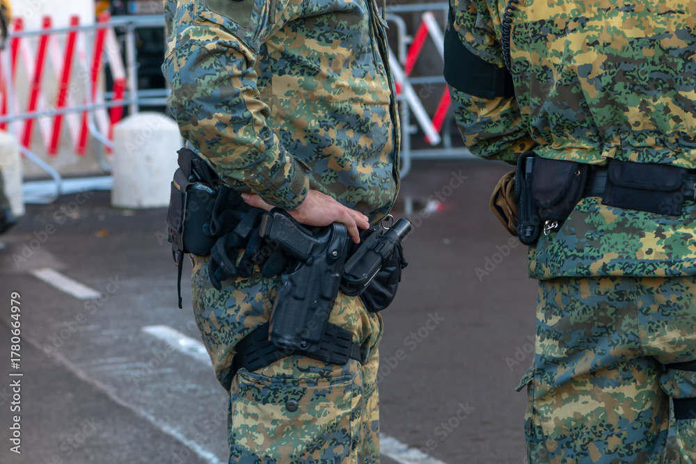 Fototapeta premium A close-up of army equipment shows details of the uniforms used by soldiers while serving in an urban environment.