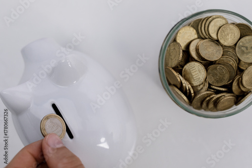 A hand placing a coin into ...