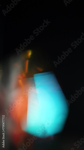 Sun glare, lens flare on a black background for transition to video. Colored rays