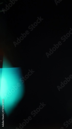 Sun glare, lens flare on a black background for transition to video. Colored rays