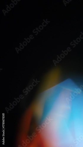 Sun glare, lens flare on a black background for transition to video. Colored rays