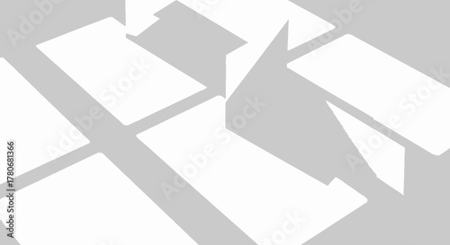 Abstract arrangement of white geometric shapes creating a modern pattern design