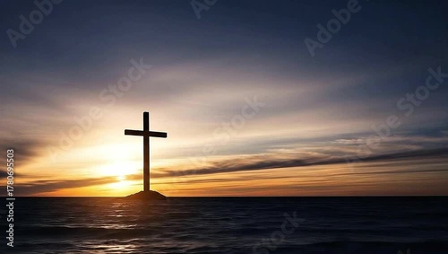 Animated cross silhouetted on a rock in the ocean against a serene sunrise sky.