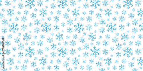 A seamless, repeating pattern of light blue snowflakes scattered across a clean white background, evoking a winter wonderland theme