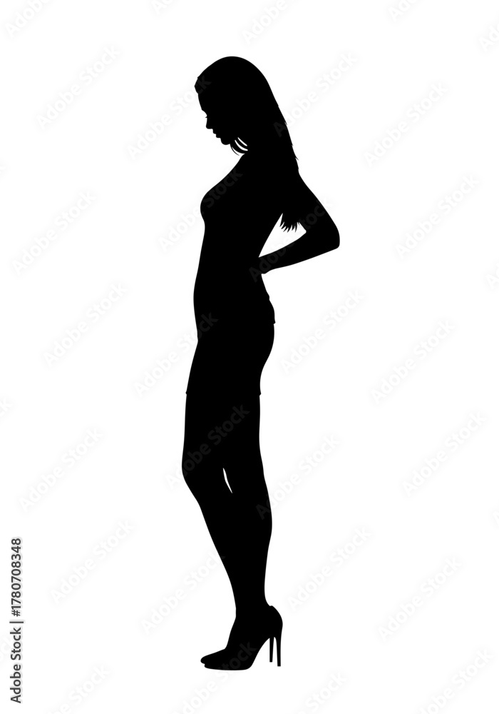 Fototapeta premium A silhouette of a slender woman with her head bowed, suggesting contemplation and elegance