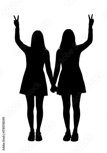 Two young woman standing together and posing peace sign with both hands