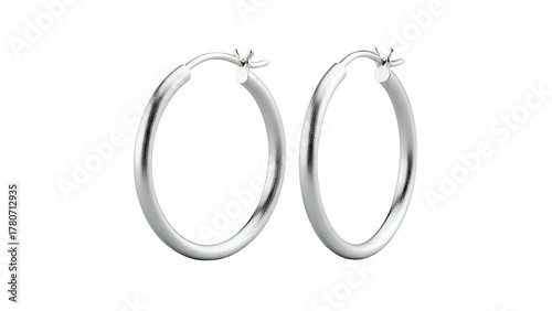 Pair of contemporary silver hoop earrings displayed against a solid black background