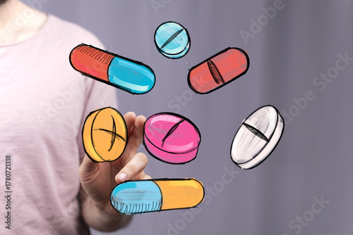 Hand holding colorful pills...