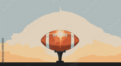 American Football on Tee with Mountain Backdrop.