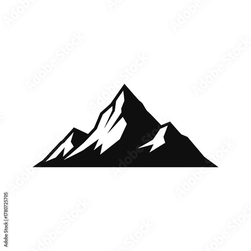 Mountain peak stands majestically against a clear sky, showcasing the rugged beauty and serene atmosphere of the natural landscape, inspiring awe and wanderlust.