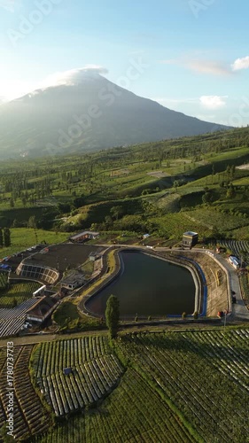 Aerial View Of Terraced Vineyard And Modern Visitor Complex In Mountainous Valley During Golden Hour