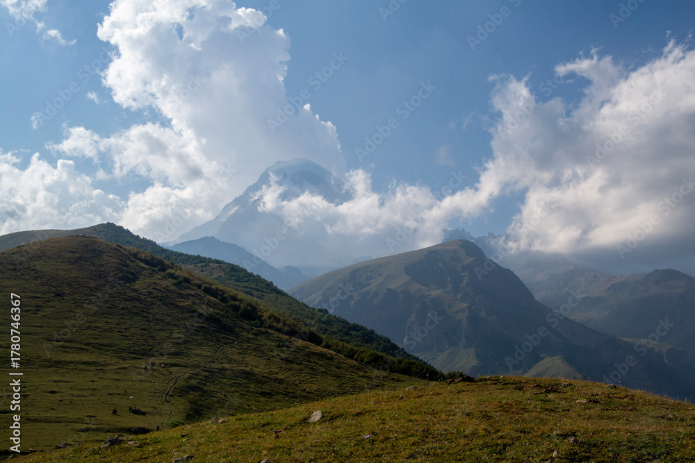 Fototapeta premium Kazbek in the clouds, Georgia