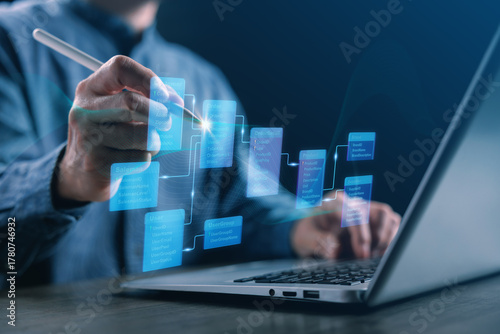Professional designing database schema and data structure on digital interface, showing data connection, system architecture, and information management for innovative business technology solutions.