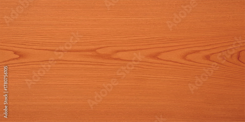 Close-up of orange wood grain texture showcasing natural patterns ideal for backgrounds and surface designs