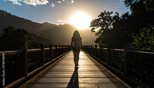 Shadow of a person walking across a bridge