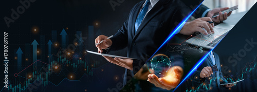 Business people and finance, interacting with tablet against a backdrop of glowing financial graphs and data. digital transformation, global investment, strategic planning modern economy.