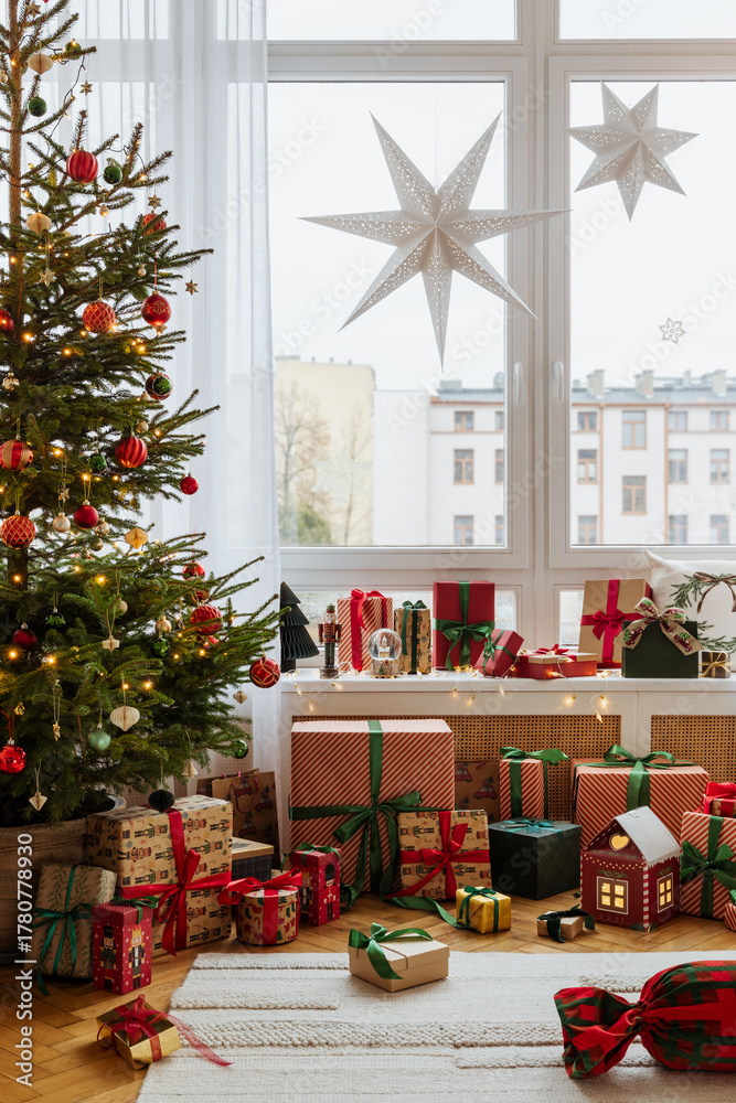 Obraz premium Cozy living room with Christmas decorations, glowing star lights, and festive pillows. Warm holiday atmosphere with gifts and soft lighting.