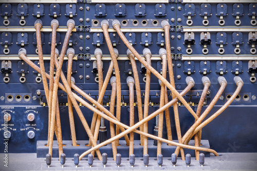 Vintage telecommunications telephone switchboard with connected wires