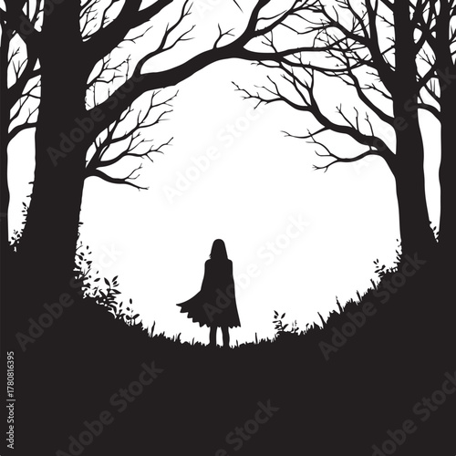 Silhouette of a person in a cape standing in a forest clearing