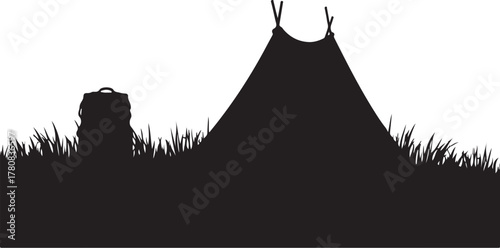 Black silhouette of a backpack and teepee on grass