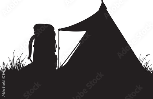 Black silhouette of a camping tent and backpack on grass