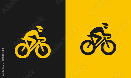 Silhouette of a cyclist in motion on a bicycle against a split yellow and black background