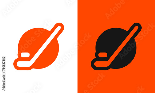 Hockey pucks with sticks one orange and white the other black and orange