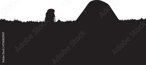 Black silhouette of a person with a backpack on a grassy hill