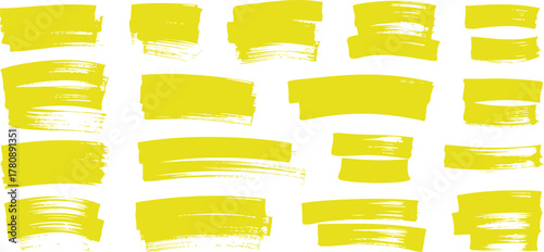 Set of diverse yellow hand drawn paint brush stroke texture marks.