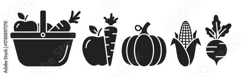 Black silhouette icons of a picnic basket with fruits and vegetables, including a carrot, apple, pumpkin, corn, and turnip, on a white background.