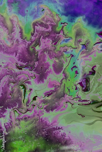 Abstract multicolored background. Acrylic paint spreads freely and creates an interesting pattern.