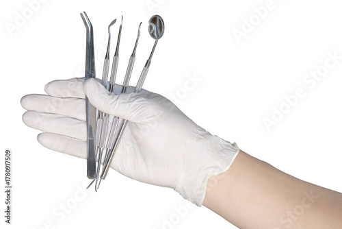 Detail of hand holding dental tools on transparency background.