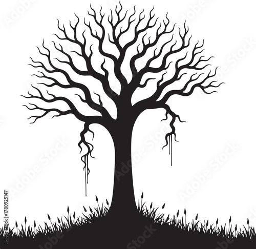 Black silhouette of a bare tree with drooping branches and grass