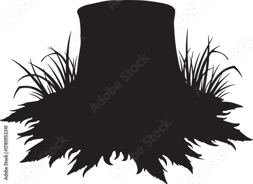 Black silhouette of tree stump with grass black and white