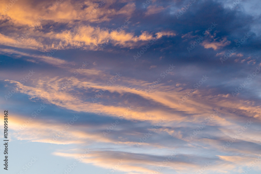 Obraz premium Swirling Clouds Catch Sunlight In The Sky Over Grand Teton
