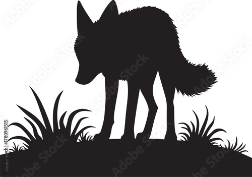 Black silhouette of a fox standing in grass white